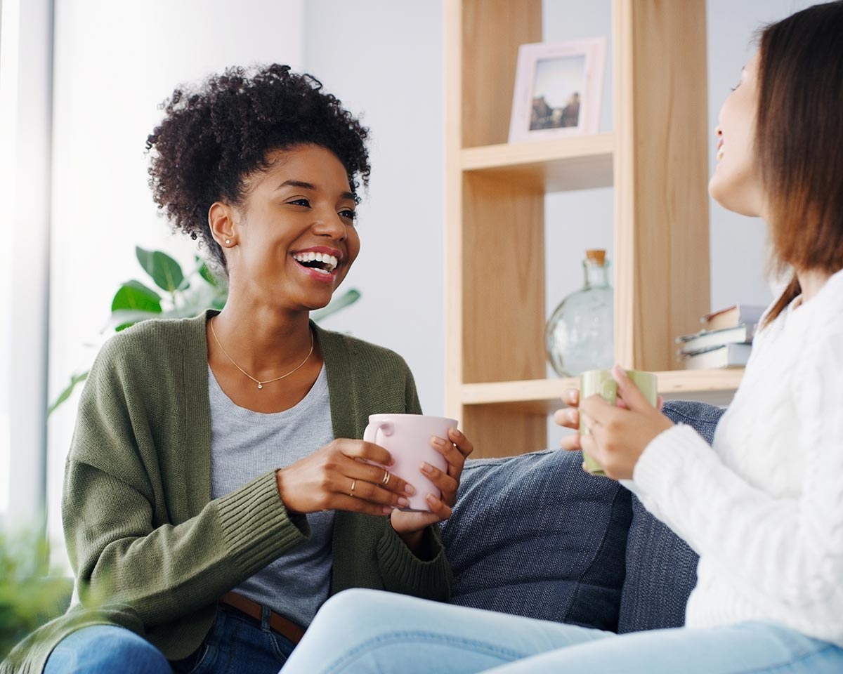 women talking couch